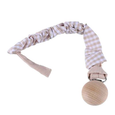 l'attache tetine à carreaux de couleur beige et blanc