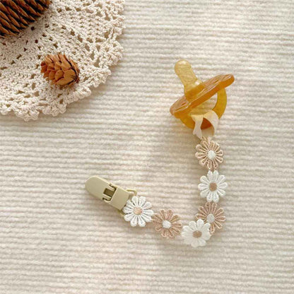 Attache tetine couleur blanc et brun