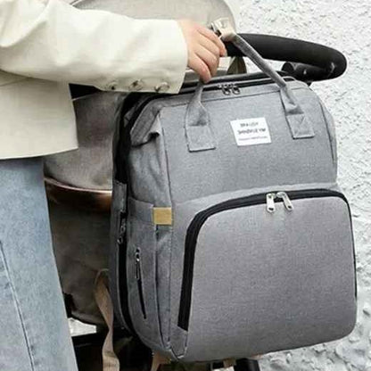 Sac a dos a langer gris s'accroche à la poussette